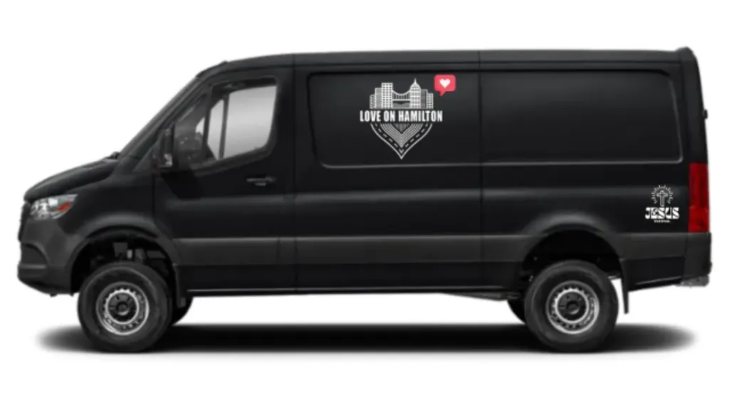 Side view of the black Love on Hamilton outreach van concept